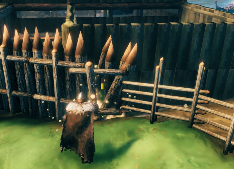 A player dismantling a wooden pole fence in Valheim using the wooden hammer