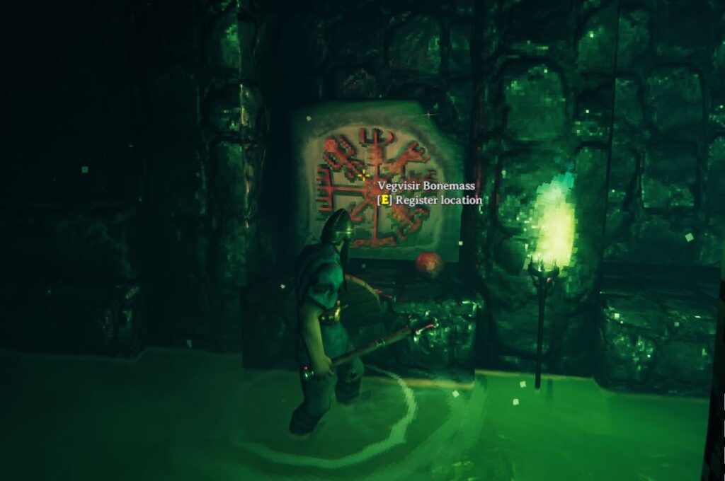the vegvisir for bonemass which is surrounded by dirst water and a green torch in Valheim